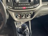 the interior of a car with a steering control and dashboard controls