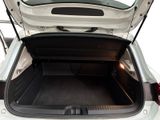 a trunk of a white car with its doors open