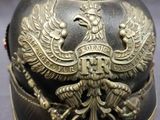 a close up of a helmet with a bird on it