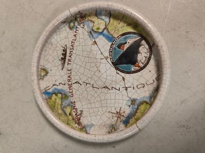 a paper plate with a map on it on a table