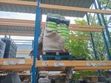 a large pile of bananas sitting on a pallet in a warehouse