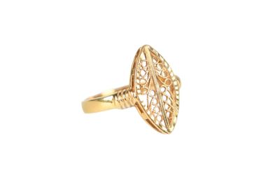a close up of a gold ring on a white background