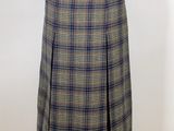 the skirt is made of plaid fabric and has a brown belt