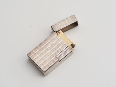 a lighter that is sitting on a white surface