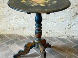 a small table with a flower design on it