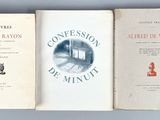 three books sitting on top of a table next to each other