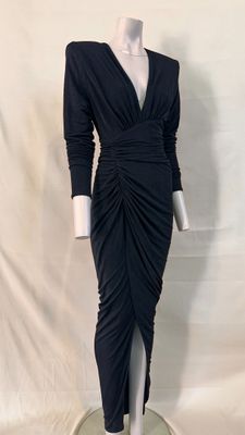 the dress is black and has long sleeves and a v - neck