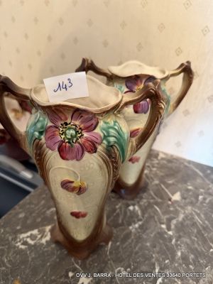 a vase with a tag on it sitting on a table