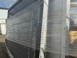 the back of a truck with a large piece of plastic on it