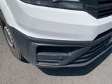 a close up of the front bumper of a white truck