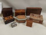 a lot of small wooden boxes on the table