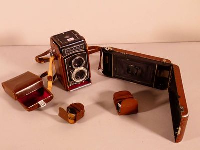 a small camera and some other items on a table