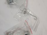 two pieces of plastic wrapped in plastic bags on a table