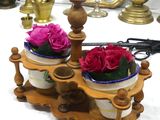 two vases with flowers in them sitting on a table