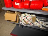 many red plastic cups on a shelf in a store