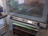 a large oven that is sitting in the middle of a kitchen