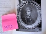 a picture of a man in a military uniform and a pink post it note