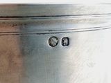 a close up of a metal container with a hole in it