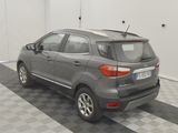 the back of a grey car is parked in a garage