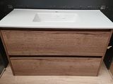a picture of a bathroom vanity with a white counter top