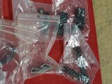 many pieces of plastic that are on a red table