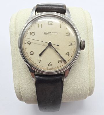 an image of a wrist watch with a black leather band
