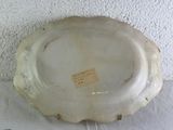 a white plate with a label on it sitting on a table