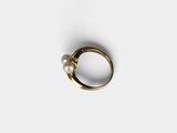 a close up of a gold ring with a pearl on it