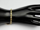 a close up of a mannequin hand with a bracelet on it