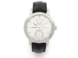 a close up of a watch on a white background