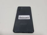 the back of a black samsung phone with a barcode on it
