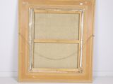 an image of a picture frame with a picture hanging on a wall