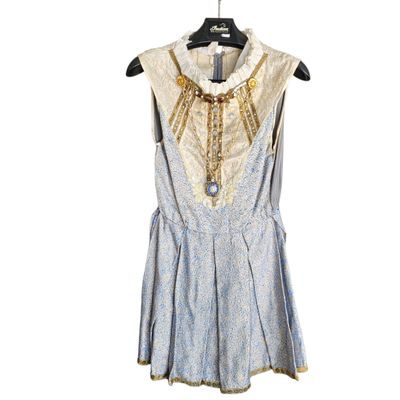 blue and white dress on a hanger on a white background