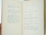 a person holding an open book in their hand