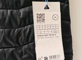 the back of a black jacket with a price tag attached to it