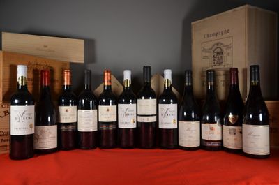 many bottles of wine sitting on a table with a red cloth
