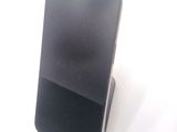 a cell phone that is sitting on top of a stand