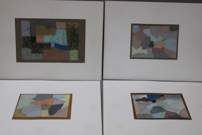 four framed paintings of different shapes and sizes on a white surface
