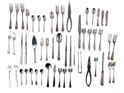 a lot of forks and spoons on a white surface