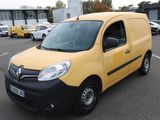 a yellow van that is parked in a parking lot
