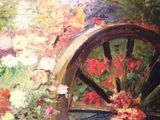 a painting of a wagon wheel with flowers on it