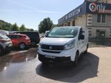 a white van that is parked in front of a building