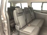 four seats in the back of a van that is empty