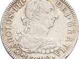 gros plan d'une pièce de monnaie sur fond blanc