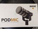 the box of the rode microphone is open on the table