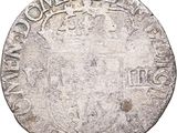 an old silver coin with a crown on top of it
