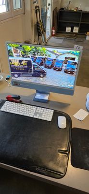 a computer on a desk with a mouse and keyboard
