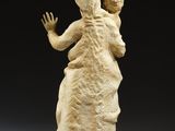 an image of a sculpture of a woman holding a child