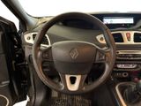 the interior of a car with a steering wheel and dashboard controls