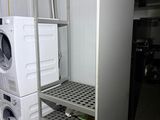a washer and a dryer in a small room
